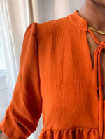 Rust puff shoulder tie front blouse
